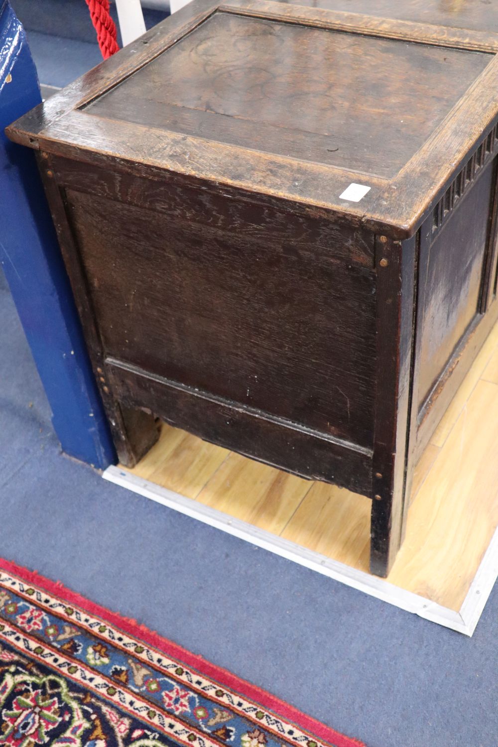 An 18th century oak panelled coffer, width 128cm, depth 52cm, height 66cm